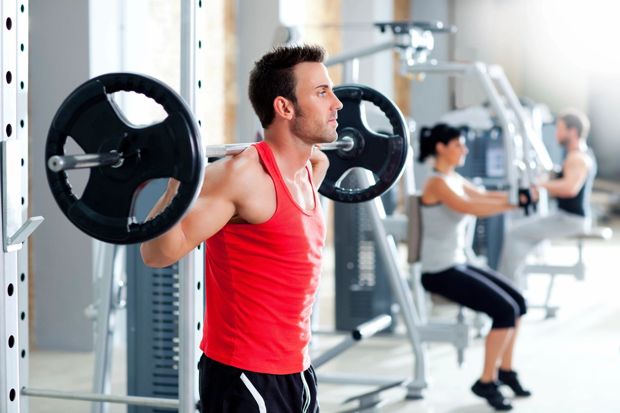 man lifting weights